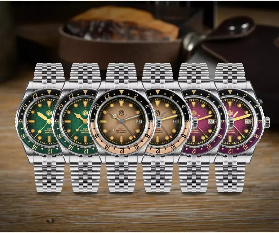 Six San Martin SN0134-G1 GMT watches with gradient green, brown and purple dials and two-tone 24-hour bezels on jubilee bracelets