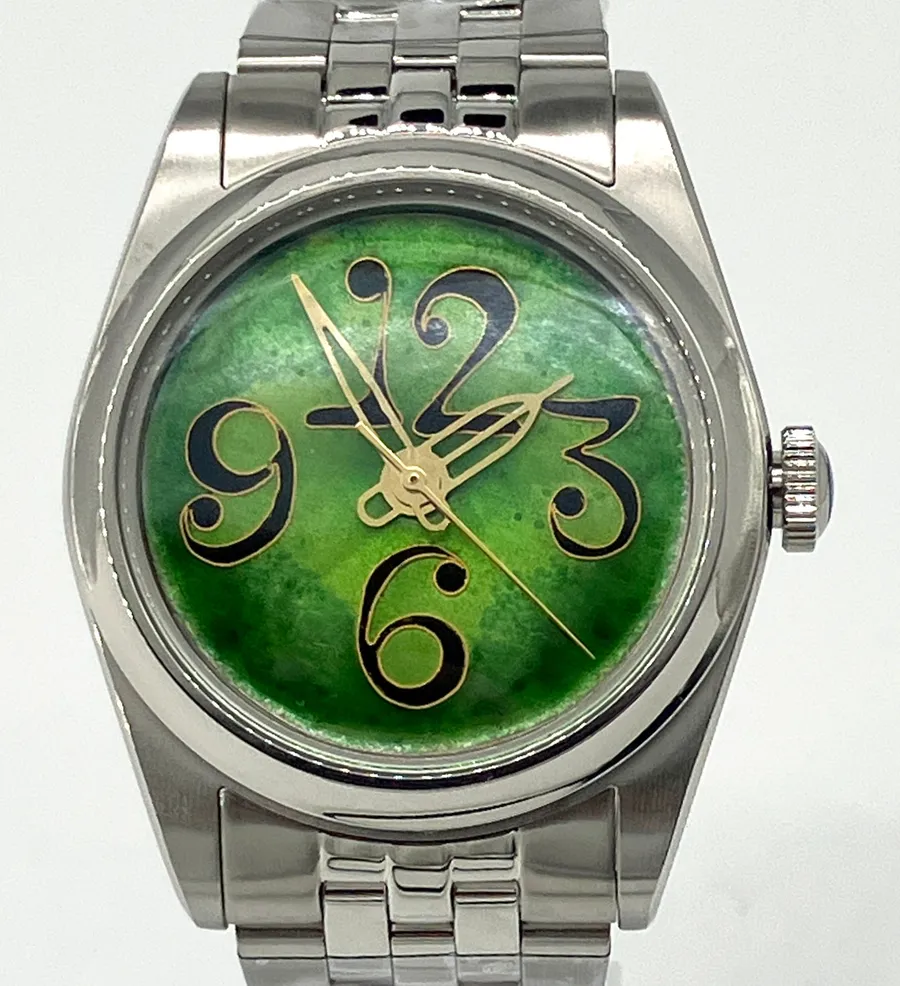 Cincinnati Watch Company The Numbers on Green, oversized black 12, 3, 6 and 9 outlined in gold wire on a green enamel dial, on a five-link bracelet