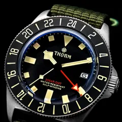 Close-up of the Thorn T020 dial with date at 3, red GMT hand and lumed 24-hour ceramic bezel