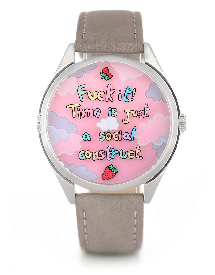 Mr Jones Berry Late Again!, letter-strewn dial with strawberry hands, steel case on grey suede, front view