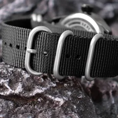 Addies 1508 strap keepers and buckle, with the engraved steel caseback behind