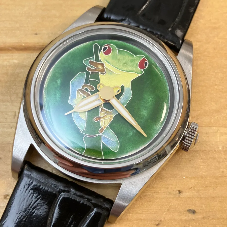 Cincinnati Watch Company Tree Frog, cloisonné enamel red-eyed tree frog on a reed against a green enamel dial, on black leather strap
