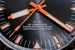 Cincinnati Watch Company Desk Diver, close-up of the black sandwich dial reading "No submersion, superlative Desk Diver, unofficially certified"