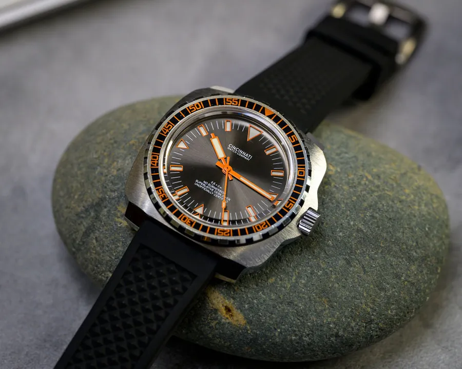 Cincinnati Watch Company Desk Diver, black dial with orange hands and bezel markings, on black waffle silicone strap
