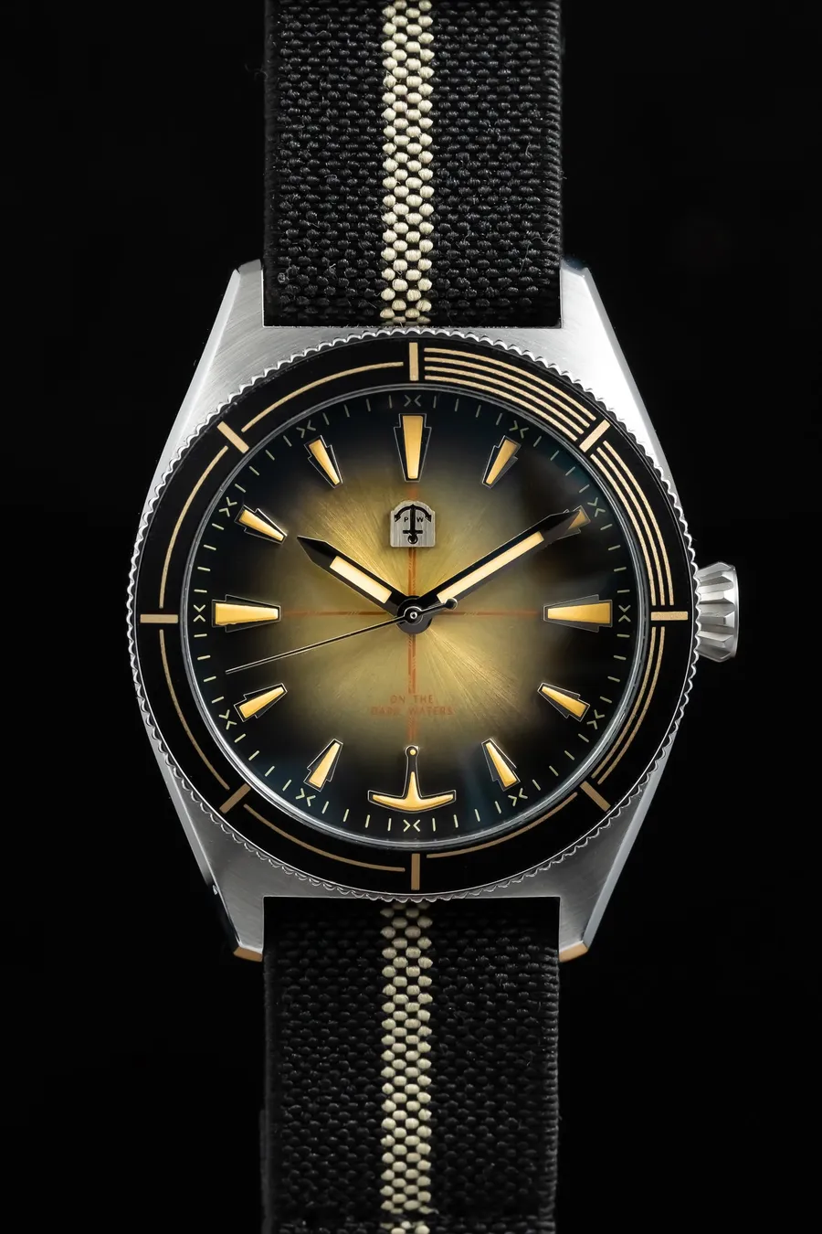 Pook Amorphis On The Dark Waters with bronze-to-navy sunburst dial and black coin-edge bezel on a black-and-beige paranato strap