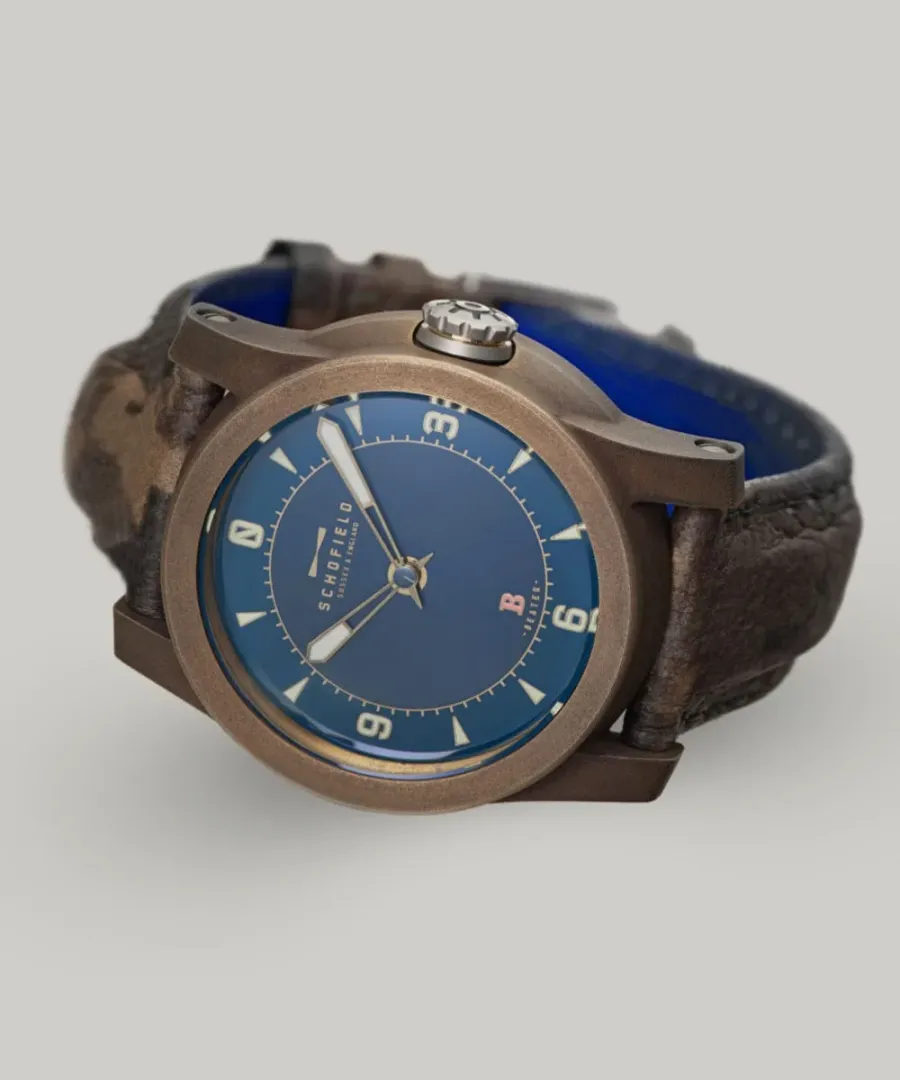 Schofield B3 in patinated bronze with a blue dial on a brown strap