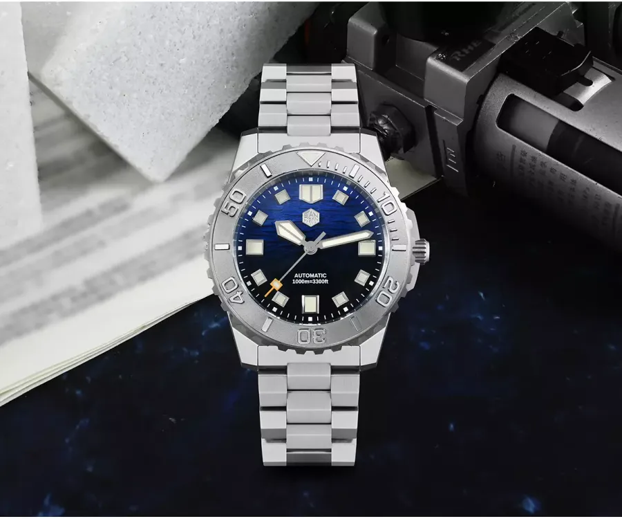 San Martin SN0147-G 43mm 1000m diver with blue ocean-wave gradient dial, no date window and steel bezel on three-link bracelet