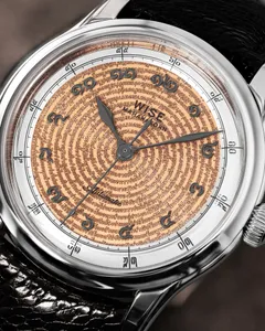 Wise Mahanakorn MHGRU120 dial close-up showing the Thai national anthem motif