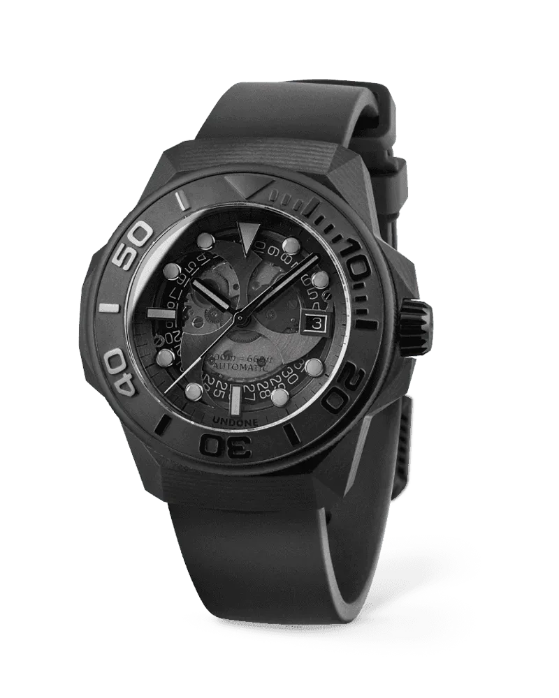 Undone x Nicola Formichetti Shungite dive watch with faceted black carbon-fibre case, black bezel and smoked translucent dial on a black rubber strap