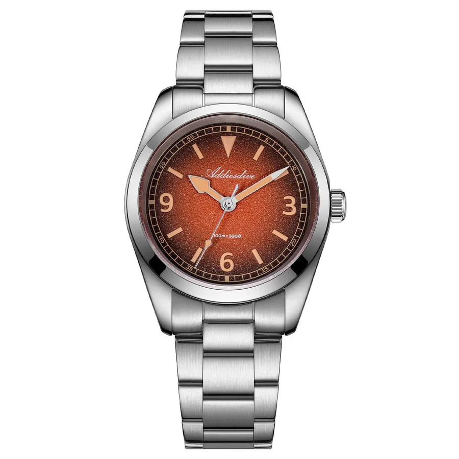Addiesdive AD2554 with orange sand-textured gradient dial, cream 3-6-9 numerals and triangle at 12 on a three-link bracelet