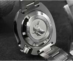 Screw-down caseback of the San Martin SN047-G-B with pressed shark