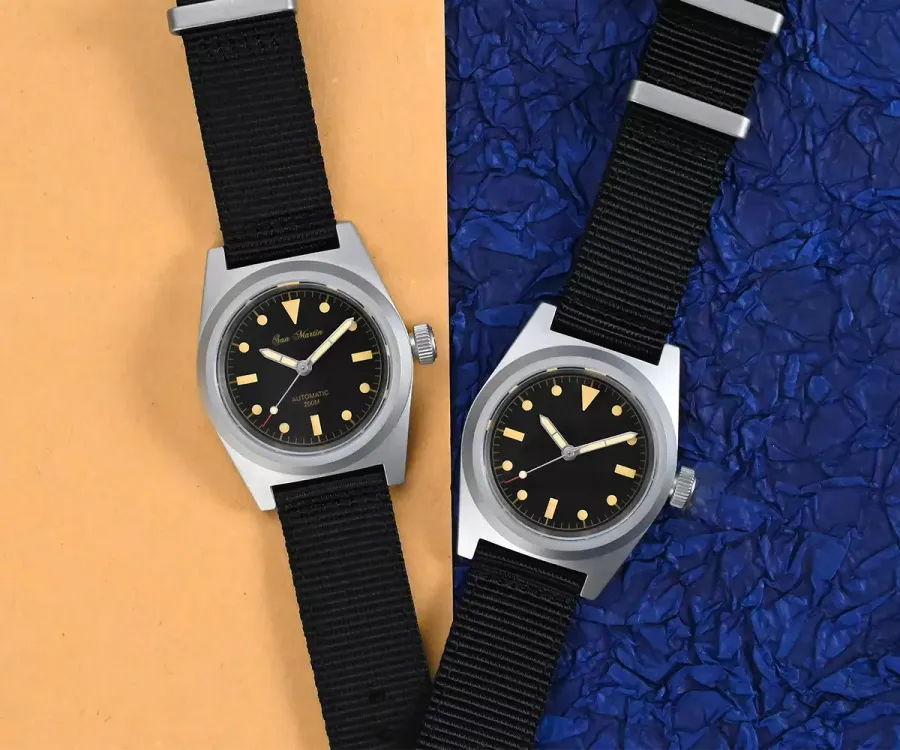 Two San Martin SN029-G 38mm military divers with black dials and vintage-tone lume on black nylon straps