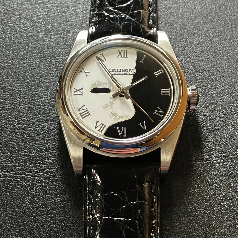 Cincinnati Watch Company Phantom, white cloisonné enamel mask on a black enamel dial with Roman numerals, on a black crocodile strap