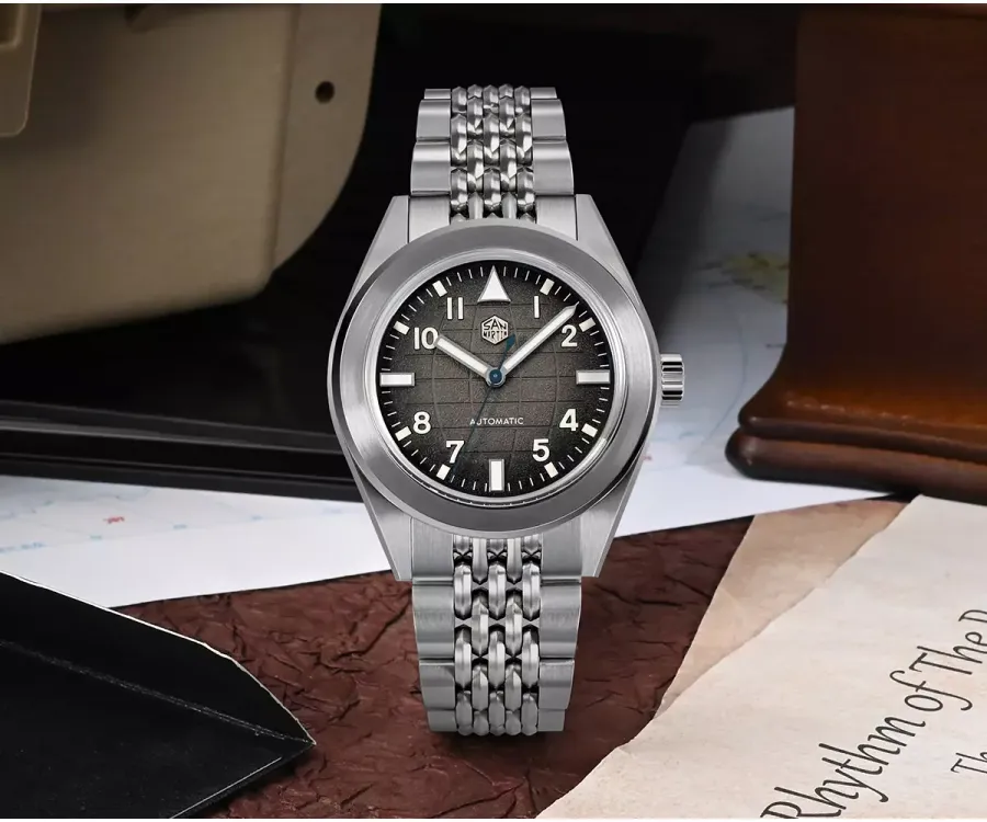 San Martin SN0131-G field watch with gradient black grid-pattern dial and Arabic numerals on beads-of-rice bracelet