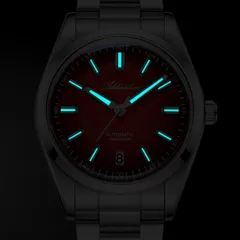 Addiesdive AD2531 lume shot of the red dial, with blue-glowing hands and markers