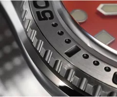 Close-up of the San Martin SN046-G engraved steel bezel