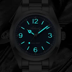 Addiesdive AD2518 lume shot of the blue dial, with blue-glowing numerals, markers and hands