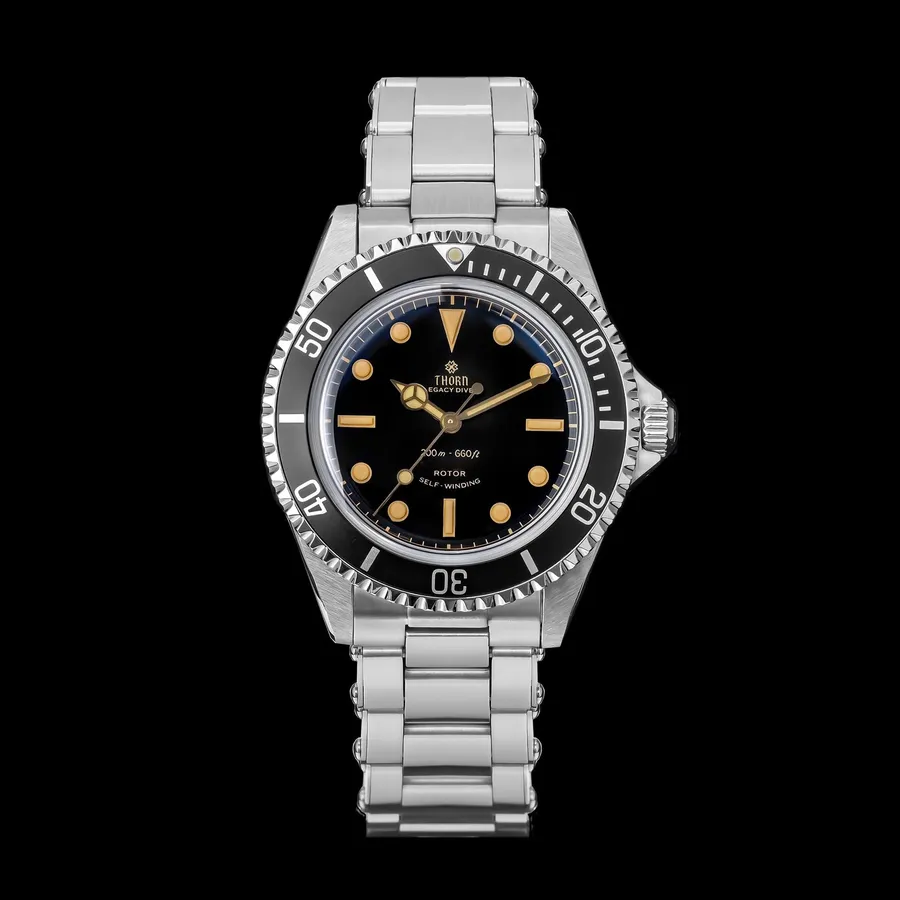 Thorn T023 V1 Submariner-style diver with black gilt dial, faux-patina lume and black aluminium bezel on the steel bracelet