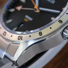 Mercer Nomad GMT Charcoal close-up of the engraved steel 24-hour bezel and crown