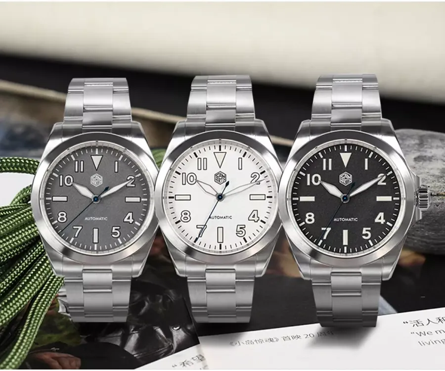San Martin SN0132-G field watches with gray, white and black fire-textured dials on three-link bracelets