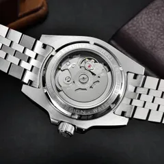 Pagani Design PD-1758 GMT display caseback engraved Water resistant 100M, showing a movement signed NH34A