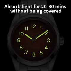 Addiesdive AD2553 lume shot of the orange dial, with green-glowing numerals and hands