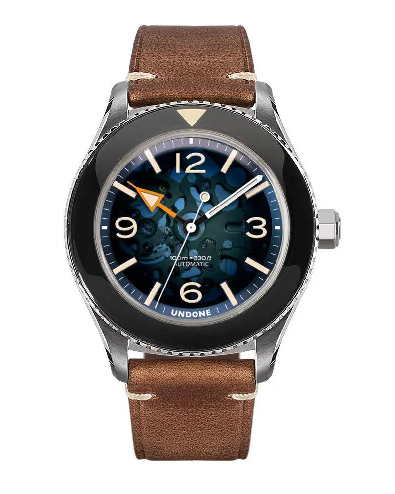 Undone Basecamp Labcraft with translucent blue dial over a skeletonised movement, black bezel and orange hour hand on a brown leather strap