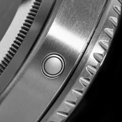 Close-up of the helium escape valve on the side of the Thorn SHY037 titanium case