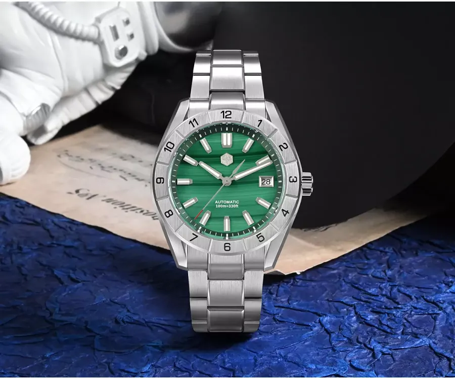 San Martin SN0130-B with green malachite dial, date at 3 and numbered steel 12-hour bezel on three-link bracelet