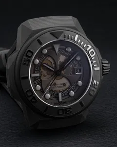 Close-up of the Undone x Nicola Formichetti dial, showing the movement through the smoked dial and the date at 3