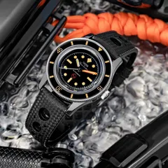 Thorn T008 titanium case and bezel seen at an angle on a perforated rubber strap