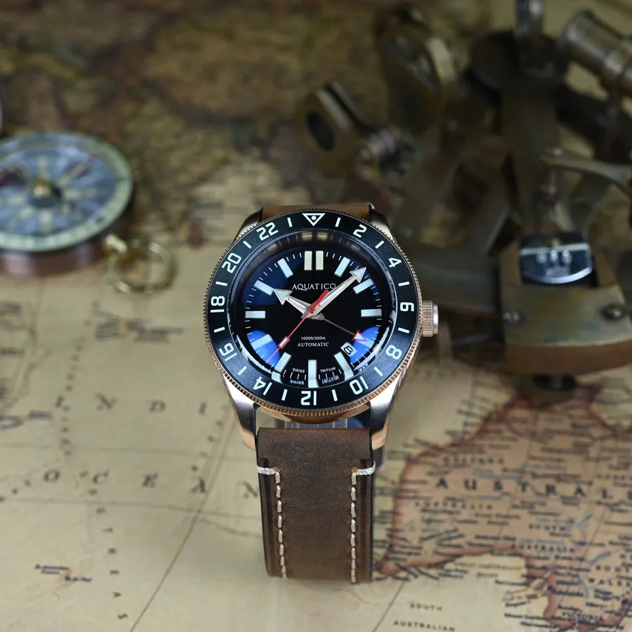 Aquatico Bronze Raider Tritium GMT with black dial and black 24-hour bezel, on brown leather strap