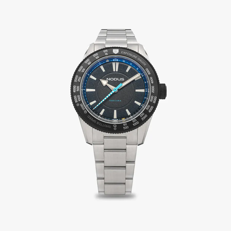Nodus Obscura II, brushed steel, grey dial, exposure-gauge bezel, on three-link bracelet
