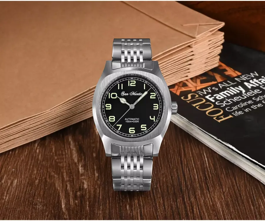 San Martin SN026-G-A with black Arabic-numeral dial on nine-link steel bracelet