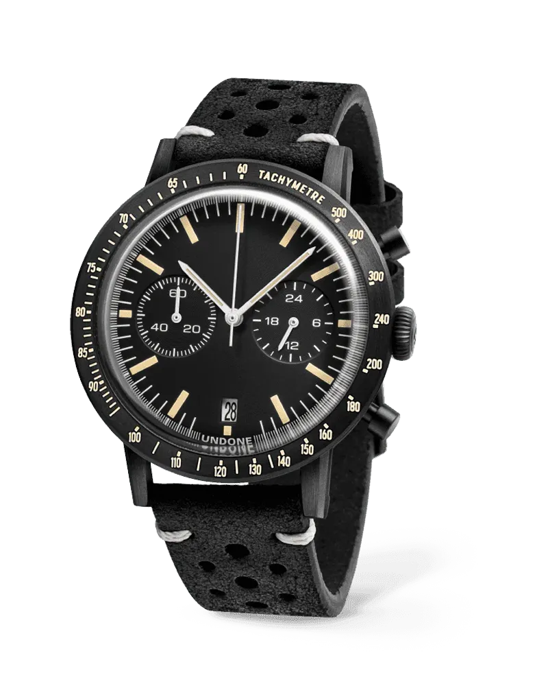 Undone Urban Sport Speedy chronograph with black-coated case, black dial and black tachymeter bezel on a black perforated rally strap