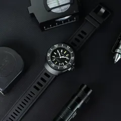 Aquatico Super Marine Tritium with black DLC case, on black rubber strap