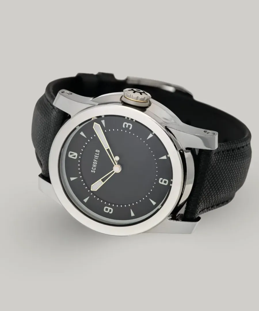 Schofield Treasure Watch in polished steel with a black dial on a black strap