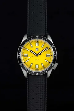 Pook Rymy with light yellow dial and black 60-minute bezel on a black tropic-style strap