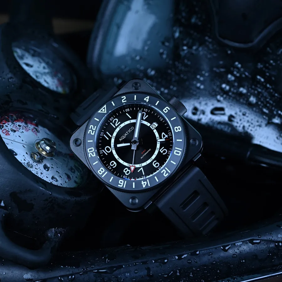Aquatico Shadow Raider GMT, black DLC square case with black numeral dial and grey 24-hour bezel, on black rubber strap