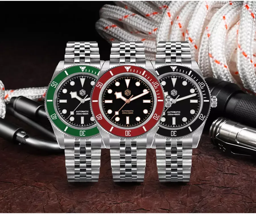 San Martin SN0128-G divers with matte black dials, snowflake hands and green, wine red and black ceramic bezels on five-link bracelets