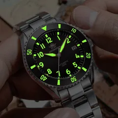 Addiesdive H9 lume shot, with green-glowing numerals, markers and hands