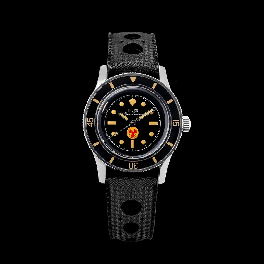 Thorn T009 Fifty Fathoms-style diver with black dial, red and yellow radiation emblem at 6 and black sapphire bezel on a black rubber strap
