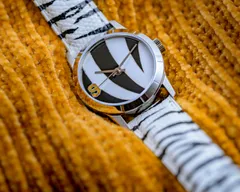 Cincinnati Watch Company White Stripes, cloisonné enamel white and black tiger stripes with an orange 9, on a hand-painted white tiger-stripe leather strap