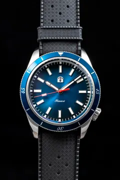Pook Ilmari with blue sunburst dial and blue dive bezel on a grey rubber strap