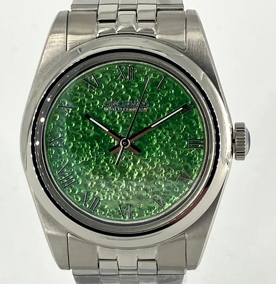 Cincinnati Watch Company Enamel over Hammered Finish, transparent green grand feu enamel over a hammered silver dial with applied Roman numerals