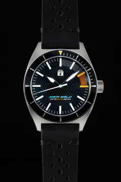 Pook Mika Salo edition with black carbon-pattern dial, orange accent and black bezel on a perforated leather strap