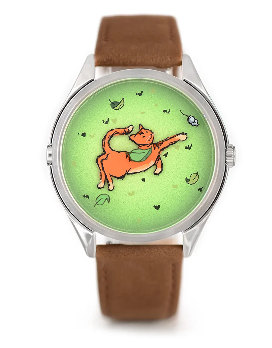 Mr Jones Mispoes!, green dial with an orange cat chasing a mouse, steel case on tan nubuck, front view