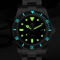 Addiesdive AD2501 lume shot, with green-glowing dial markers and hands and a blue-glowing bezel scale