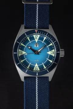 Pook 1938 with turquoise gradient dial and navy dive bezel on a navy paranato strap