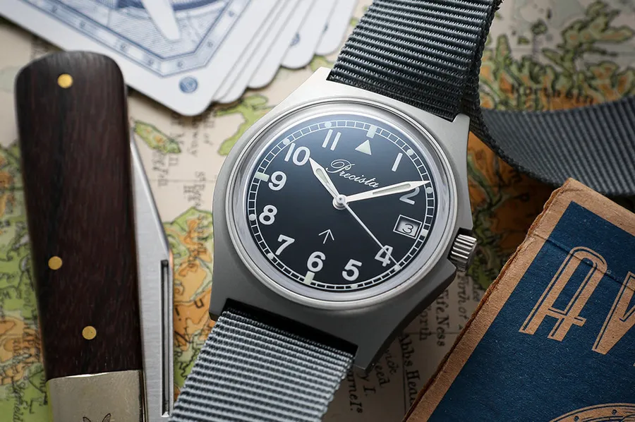 Timefactors Precista Military PRS-10 Sapphire, black military dial with broad arrow and date at 3, on grey NATO strap